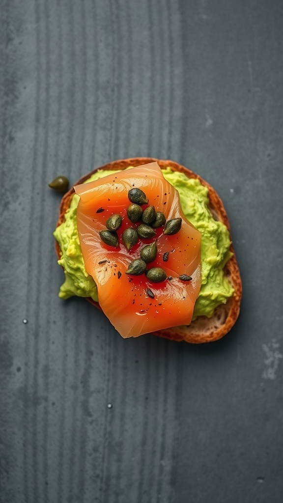 Delicious smoked salmon avocado toast topped with capers on a wooden table.